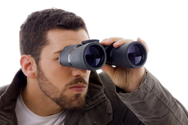 man binoculars stalking
