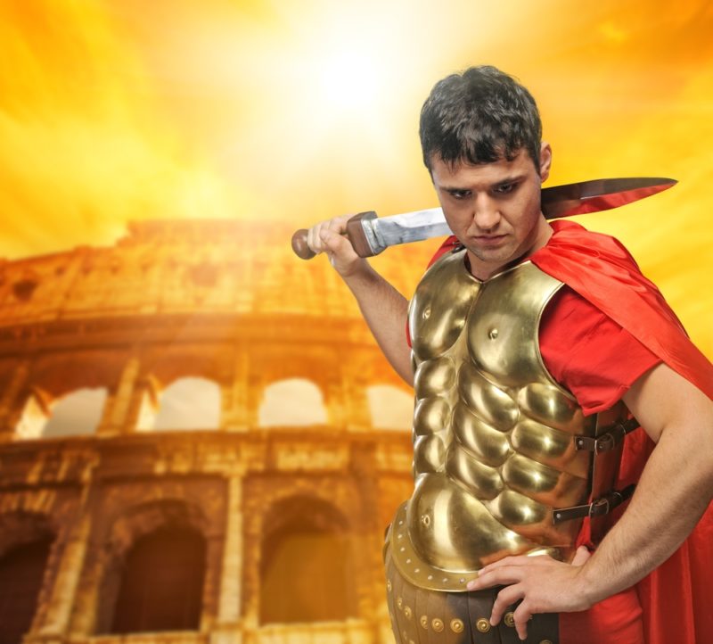 roman centurion in front of the Colosseum - deposit photos